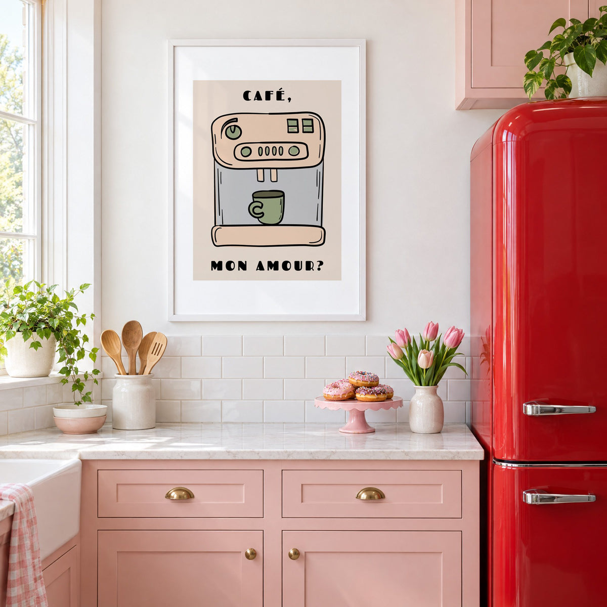 Café mon amour espresso machine print in a white frame in a pink kitchen beside a red retro fridge