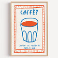Caffe cobalt glass print in a light oak frame on a plain white wall