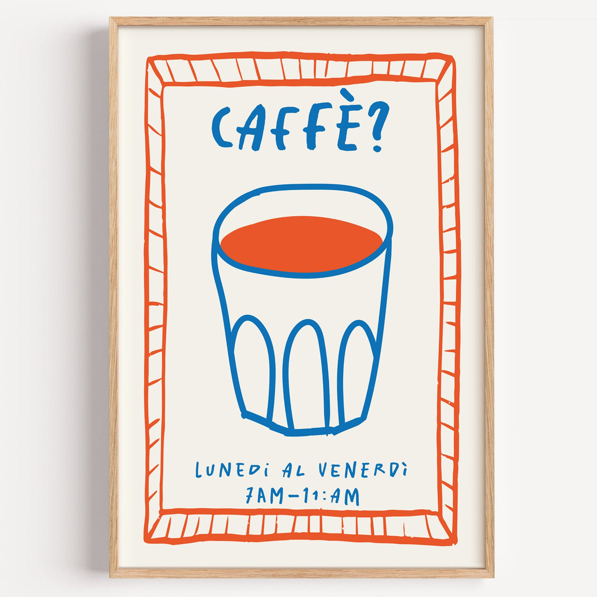 Caffe cobalt glass print in a light oak frame on a plain white wall