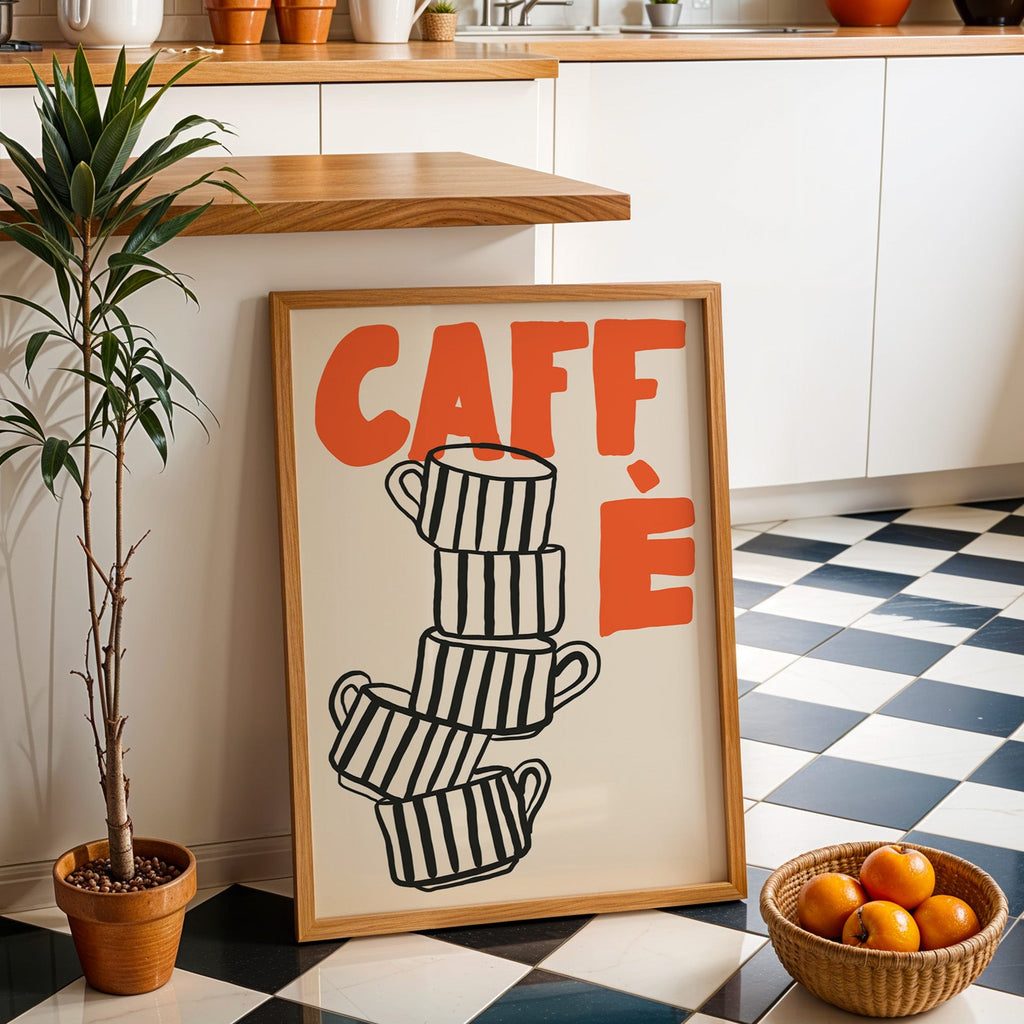 Stacked espresso cups print in an oak frame by a kitchen island and checkered floor