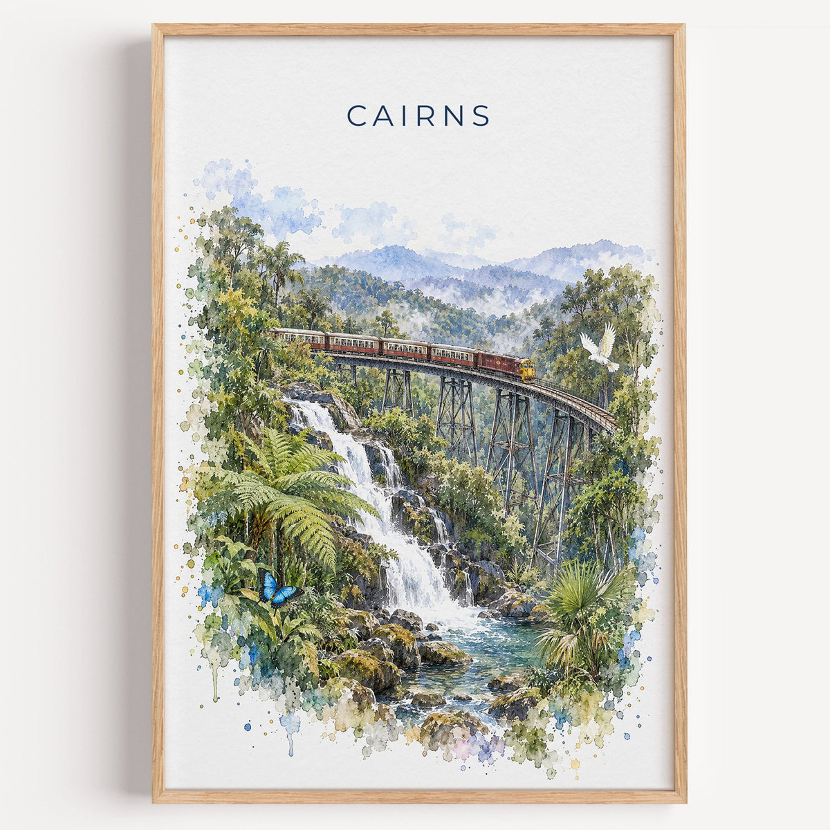 Cairns, Australia watercolor print in a light oak frame on a plain white wall