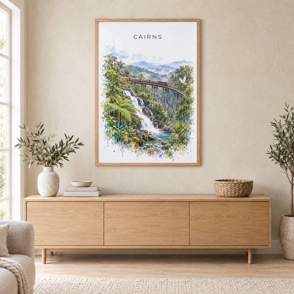 Cairns, Australia watercolor print in an oak frame above a light wood sideboard in a Scandinavian living room