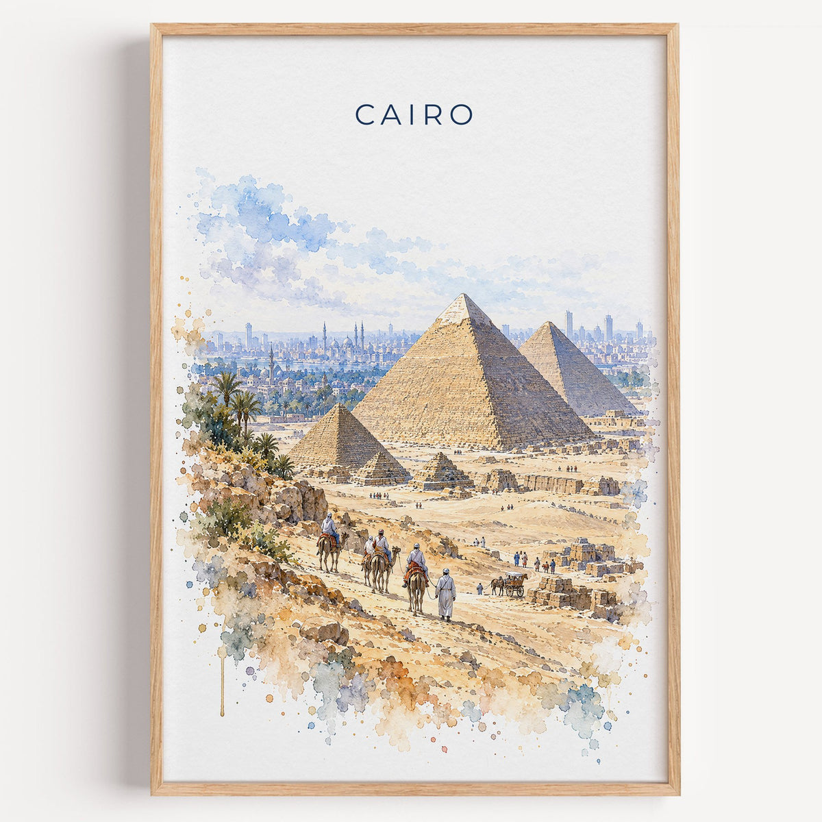 Cairo watercolor print in a light oak frame on a plain white wall