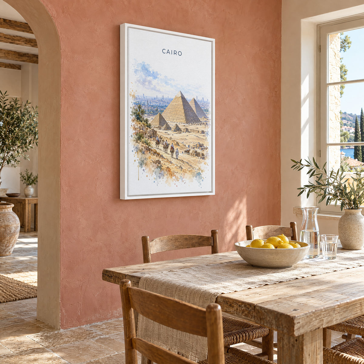 Cairo watercolor print as a white floater canvas on a terracotta wall above a rustic dining table
