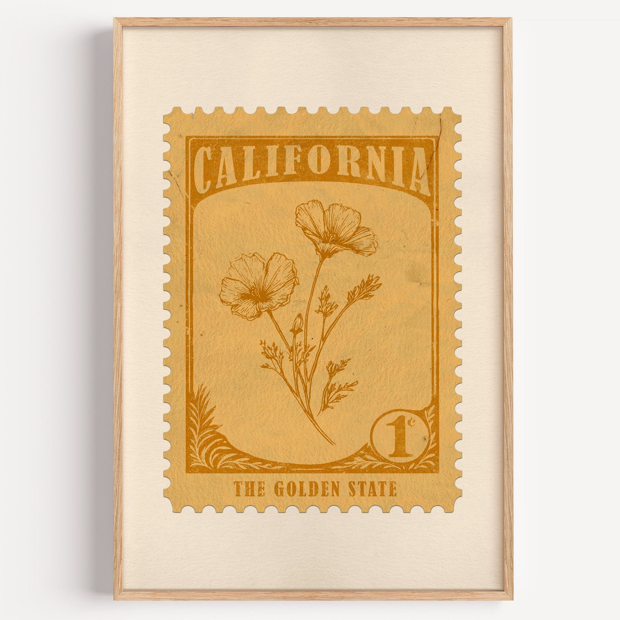 California state flower stamp print in amber gold on tan, light oak frame on a plain white wall