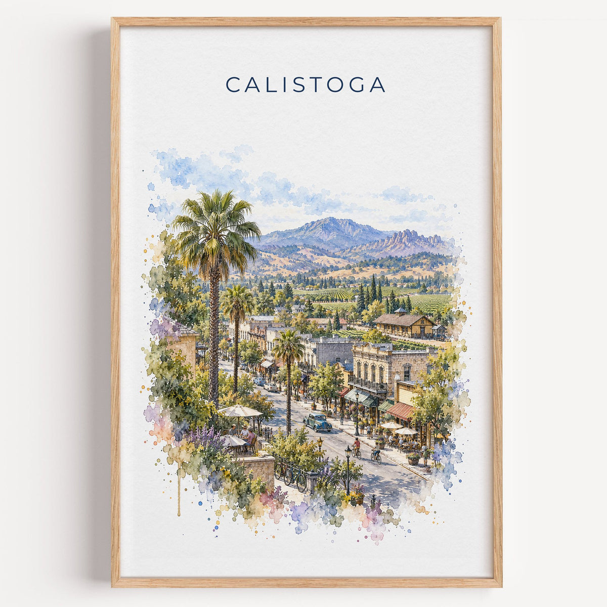 Calistoga, California watercolor print in a light oak frame on a plain white wall