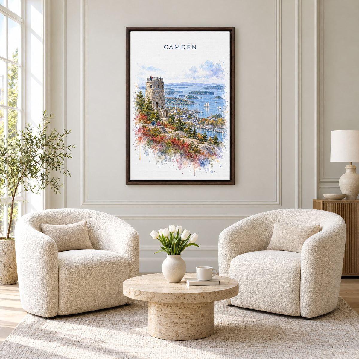 Camden, Maine watercolor print as an espresso floater canvas above two boucle armchairs in a hotel lounge