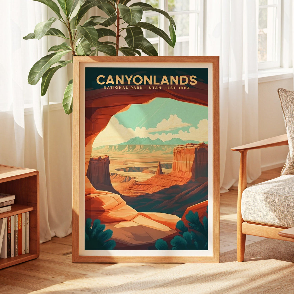 Canyonlands National Park print in an oak frame by a sunlit window with sheer curtains