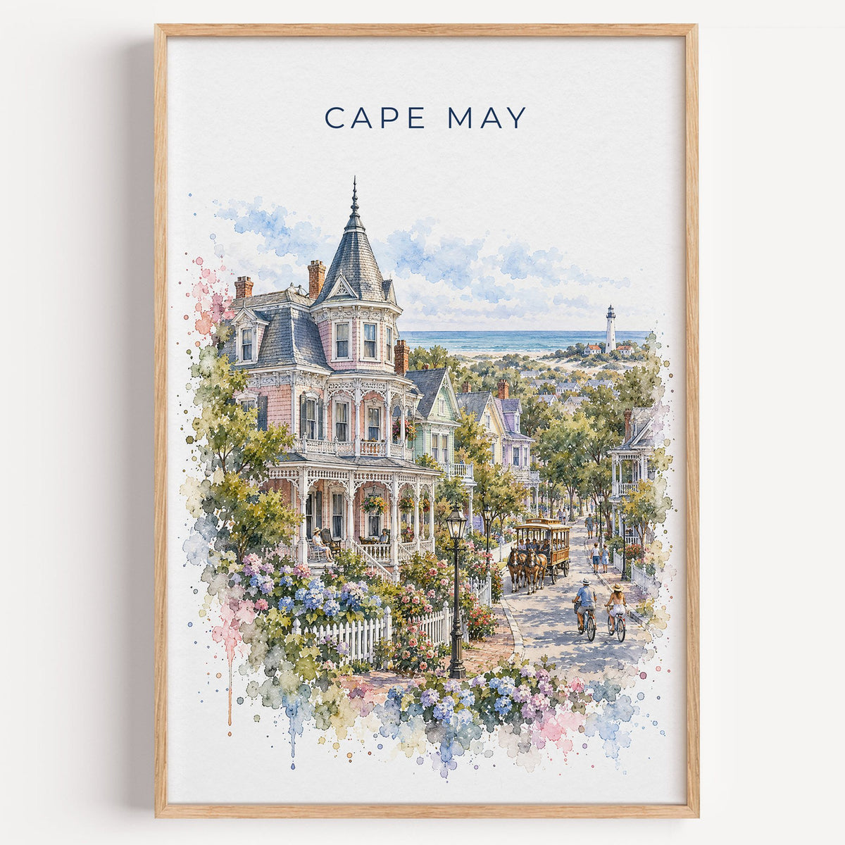 Cape May watercolor print in a light oak frame on a plain white wall