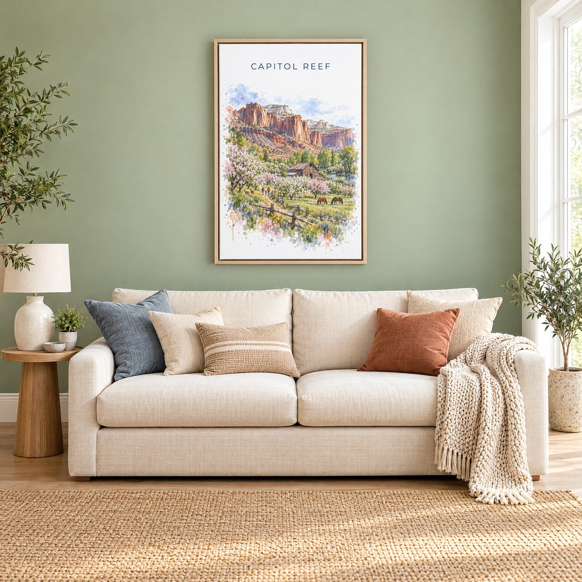 Capitol Reef National Park watercolor print as a natural floater canvas above a cream linen sofa on a sage green wall