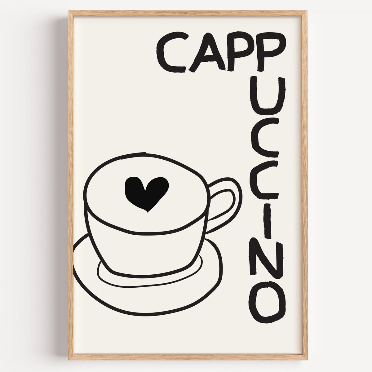 Cappuccino heart line print in a light oak frame on a plain white wall