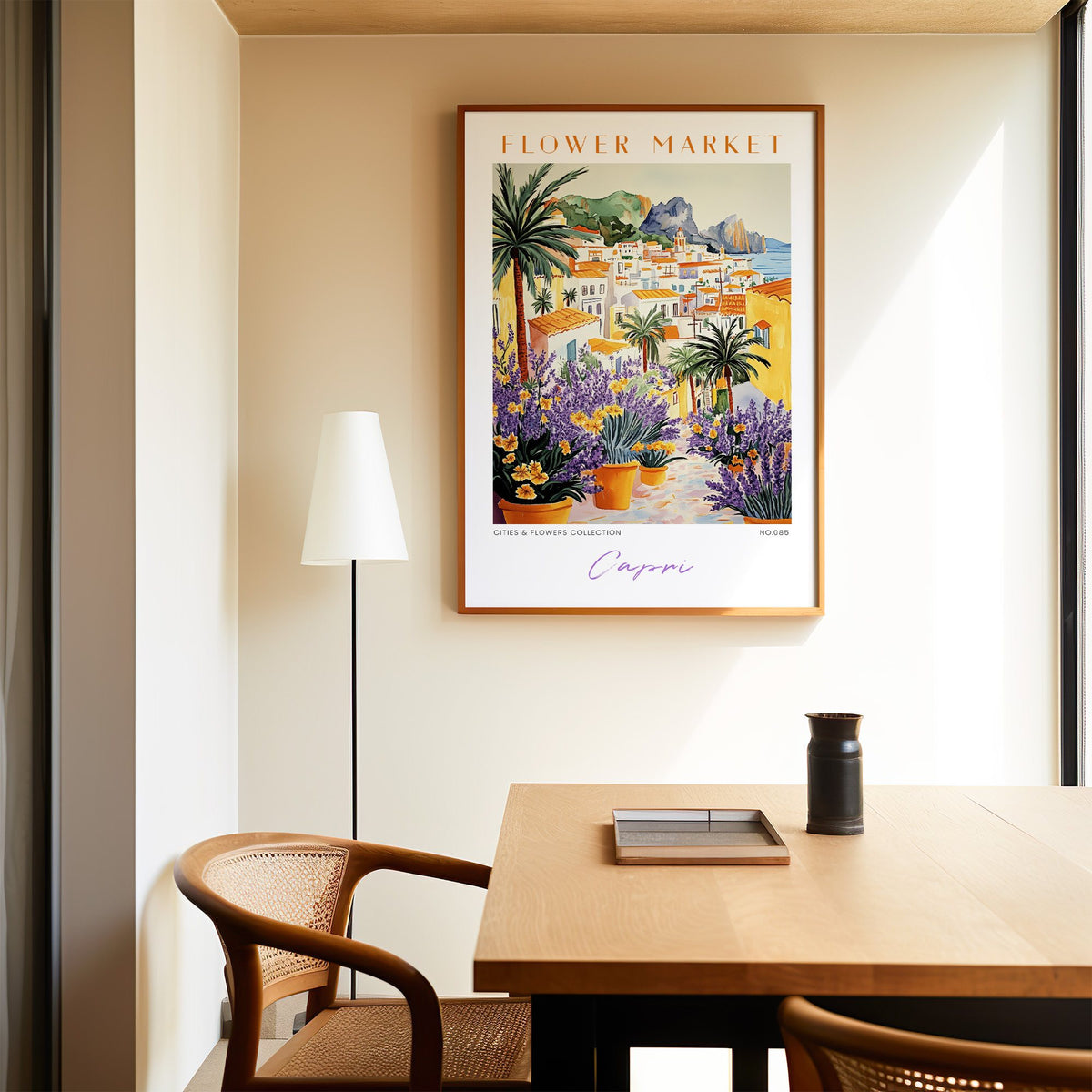 Capri flower market print in an oak frame above a dining table and cane chair