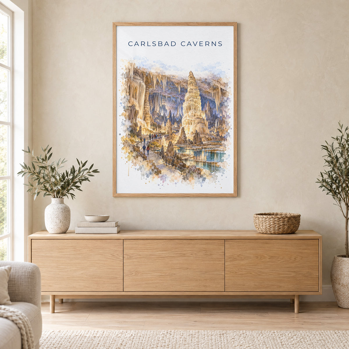 Carlsbad Caverns National Park watercolor print in an oak frame above a light wood sideboard in a Scandinavian living room