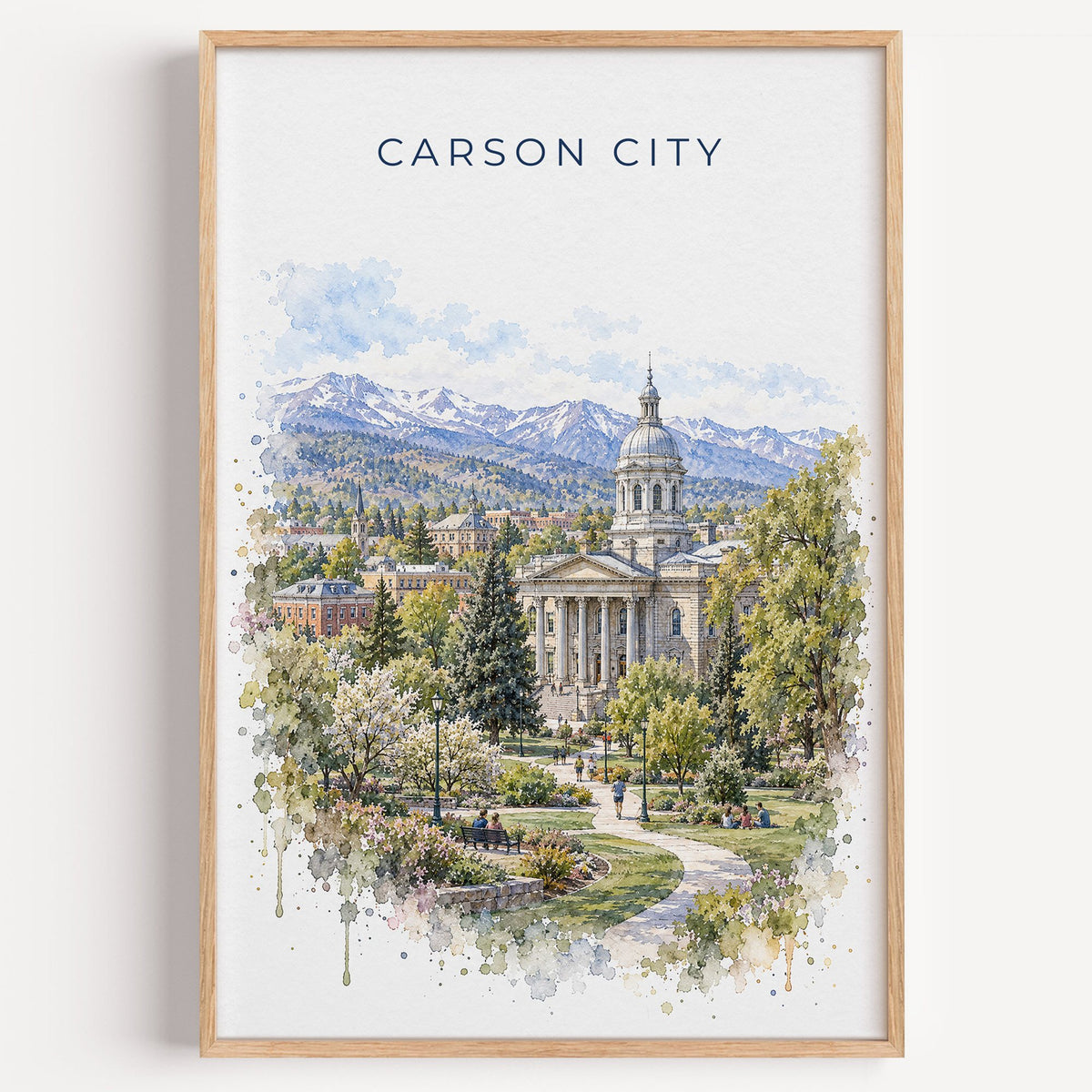 Carson City watercolor print in a light oak frame on a plain white wall