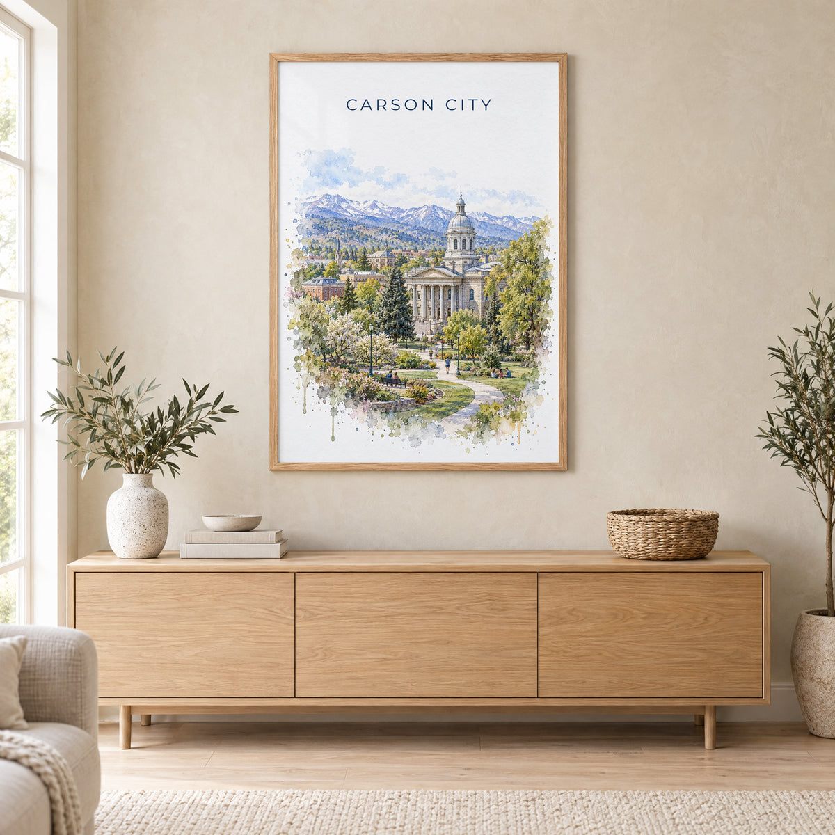 Carson City watercolor print in an oak frame above a light wood sideboard in a Scandinavian living room