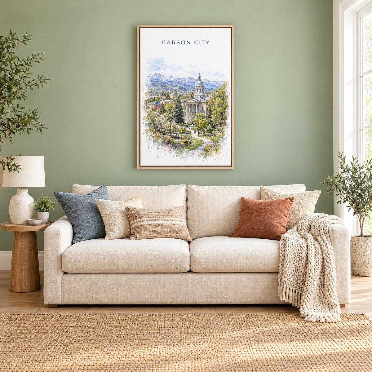 Carson City watercolor print as a natural floater canvas above a cream linen sofa on a sage green wall