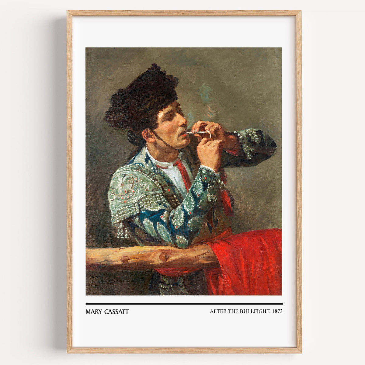 Mary Cassatt After the Bullfight print in a light oak frame on a white wall