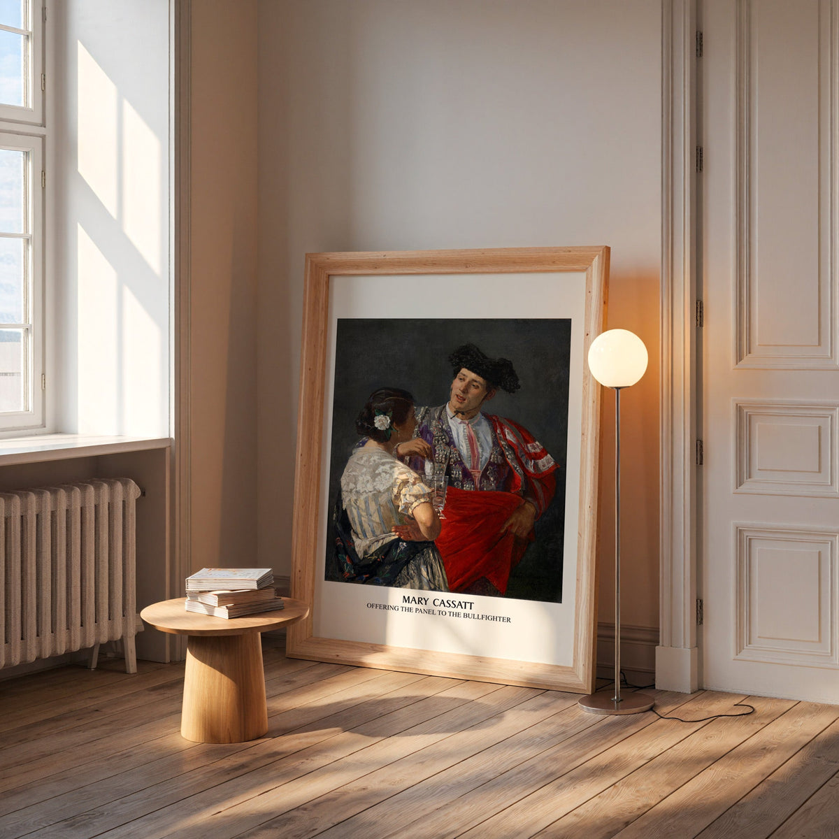 Bullfighter print in a wide pine frame leaning by a sunlit window