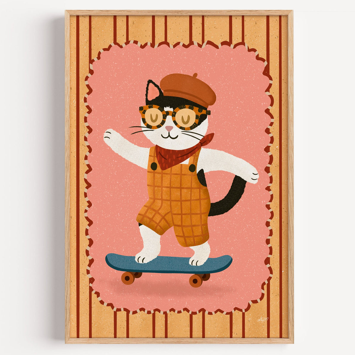Black and white cat on skateboard nursery print in a light oak frame on a plain white wall