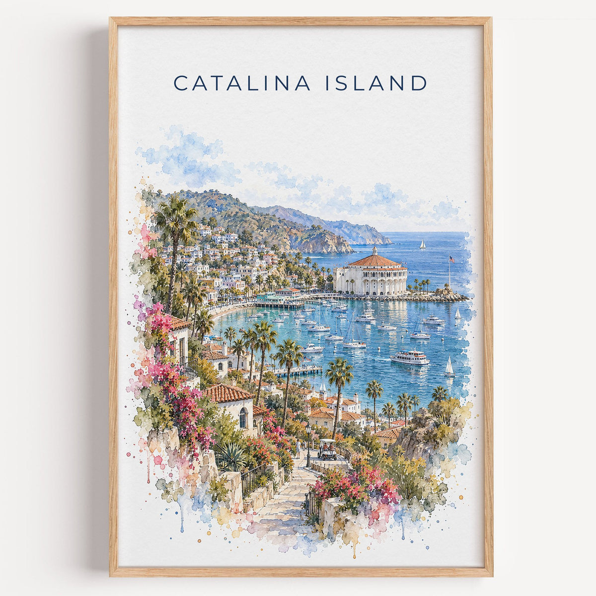 Catalina Island watercolor print in a light oak frame on a plain white wall