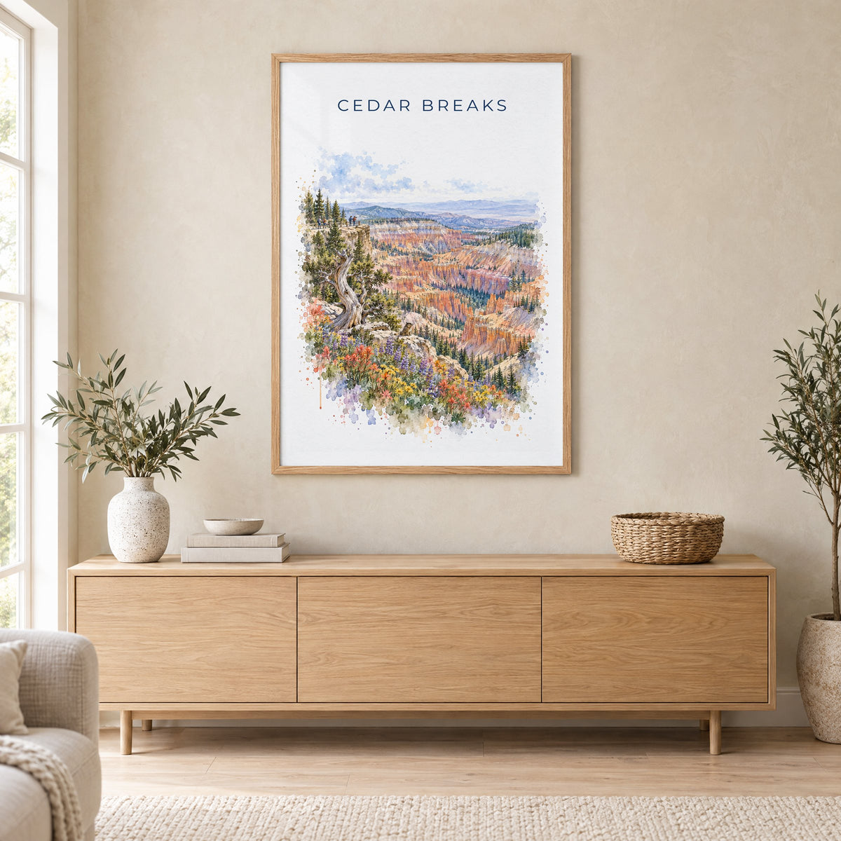 Cedar Breaks National Monument watercolor print in an oak frame above a light wood sideboard in a Scandinavian living room