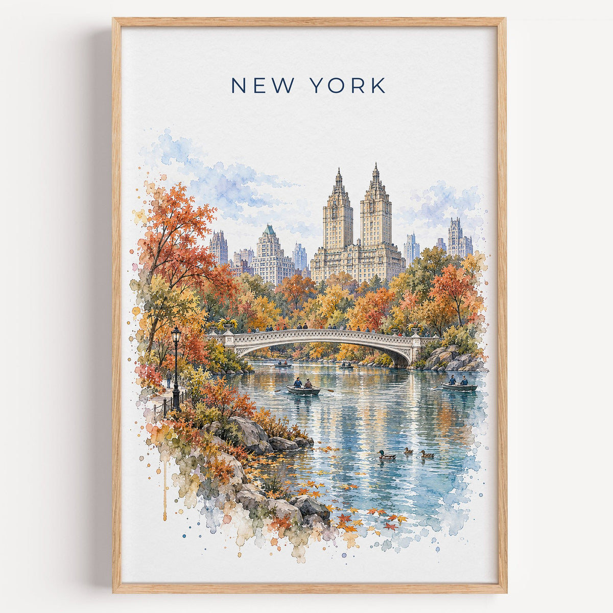 Central Park watercolor print in a light oak frame on a plain white wall