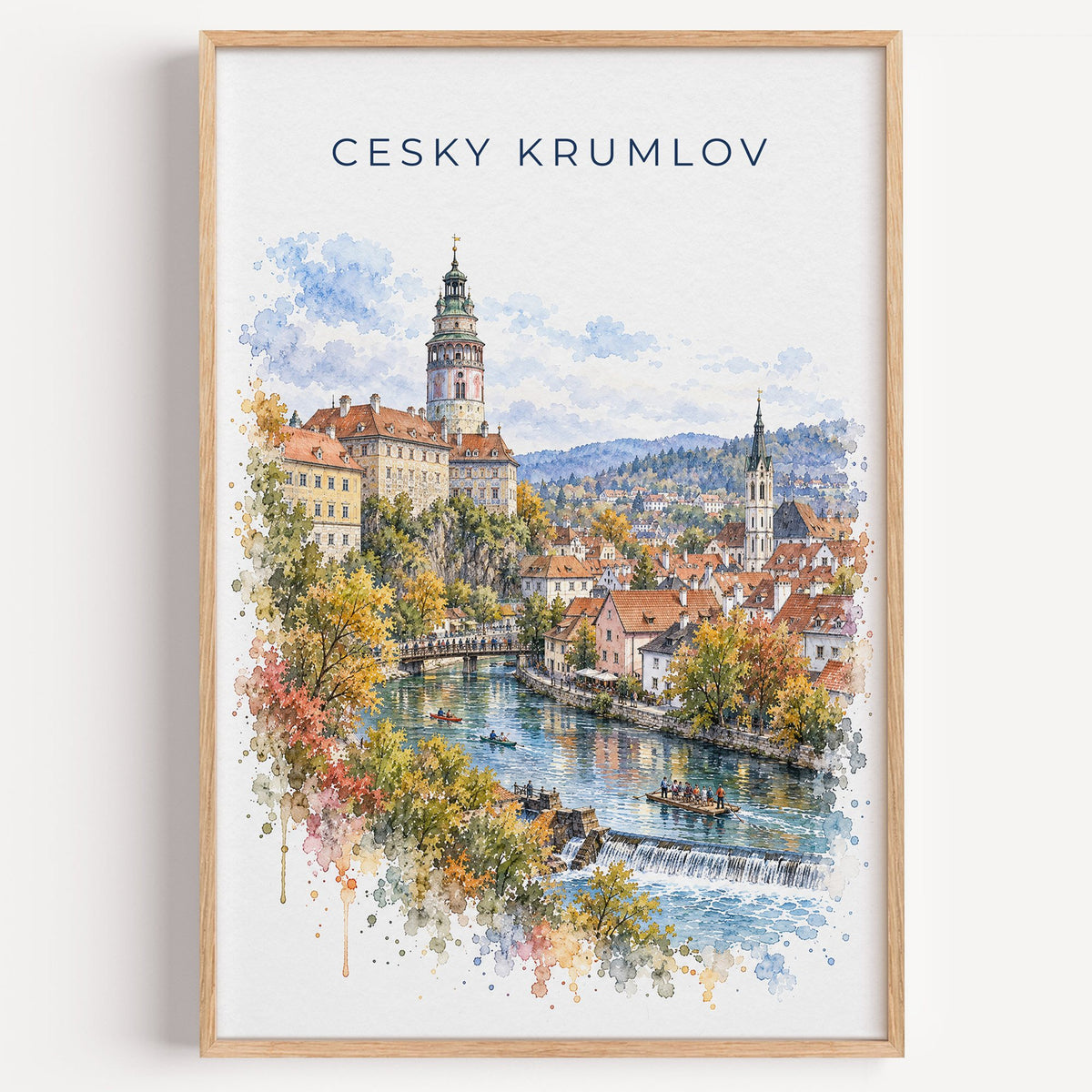 Cesky Krumlov watercolor print in a light oak frame on a plain white wall