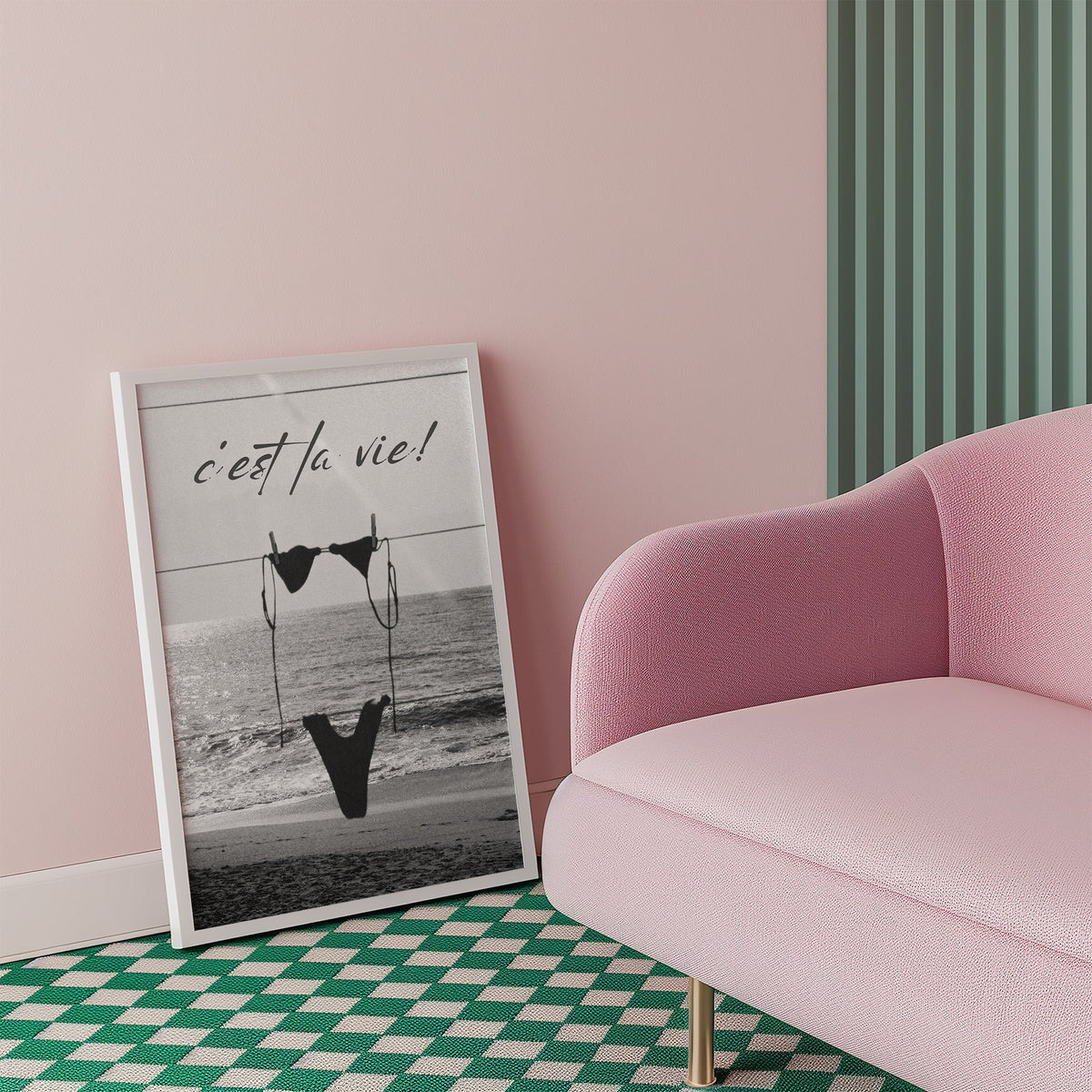Black bikini on a clothesline over the sea print in a white frame beside a pink armchair on a checkered floor