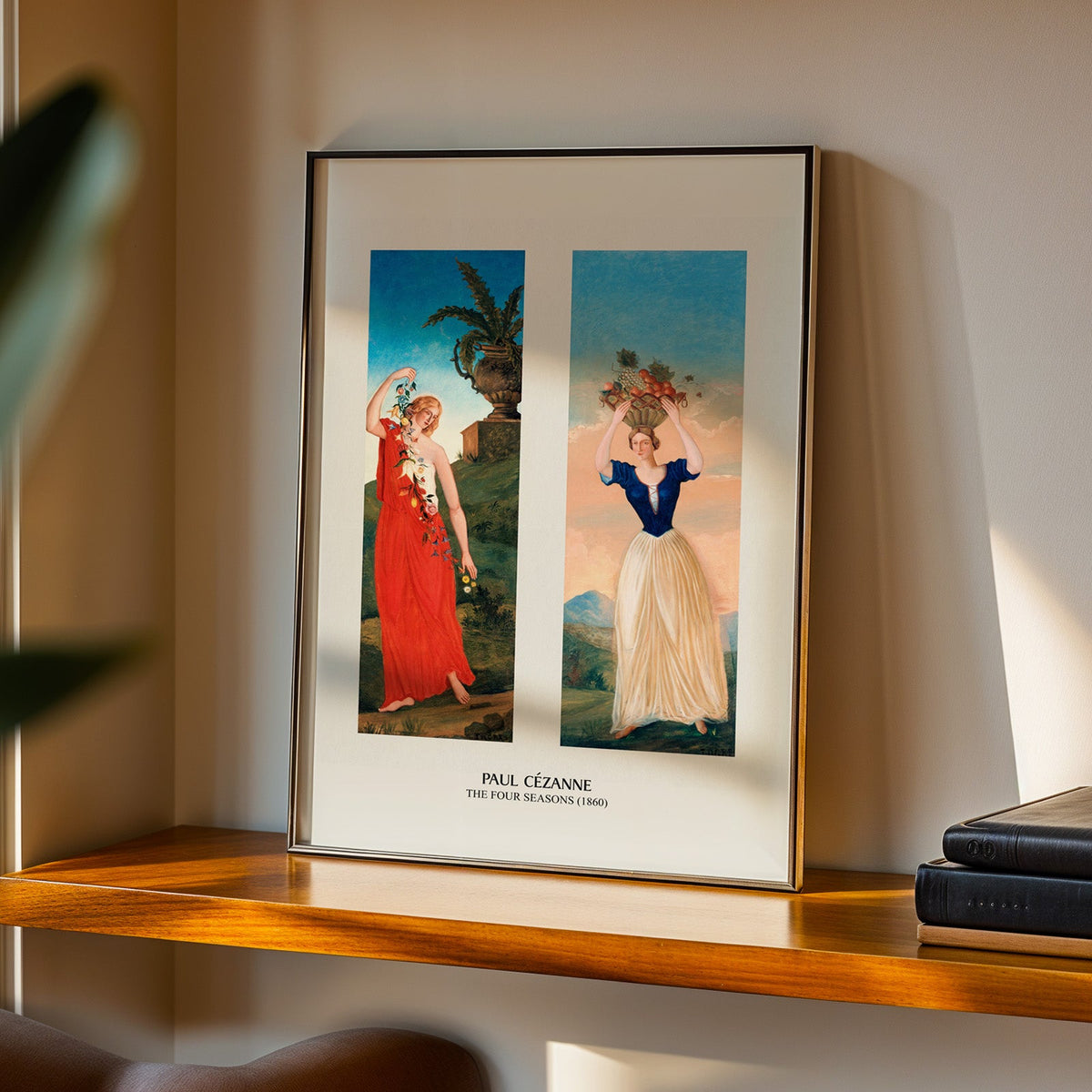 Cézanne allegory print in a black frame on a walnut shelf in evening light
