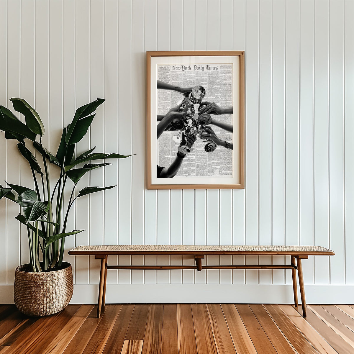 Champagne toast collage on 1851 newspaper print in a wood frame with a white mat above a cane bench