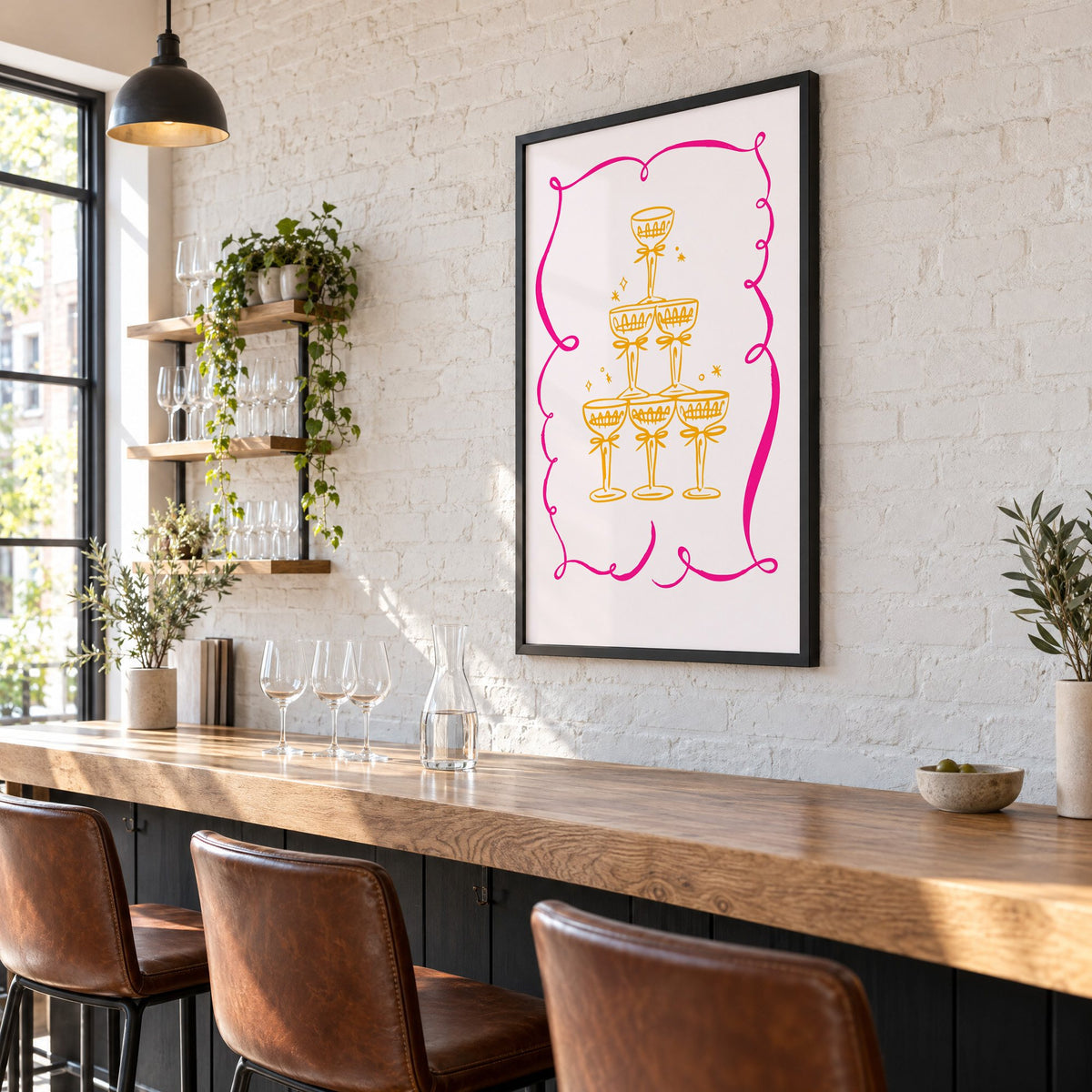 Champagne tower pink ribbon frame print in a black frame on a white brick wall above a wine bar counter