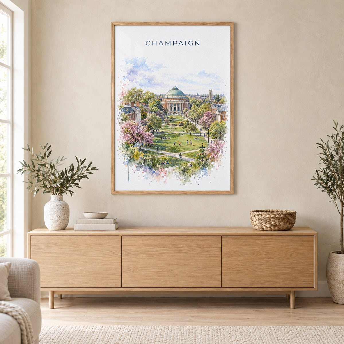 Champaign watercolor print in an oak frame above a light wood sideboard in a Scandinavian living room