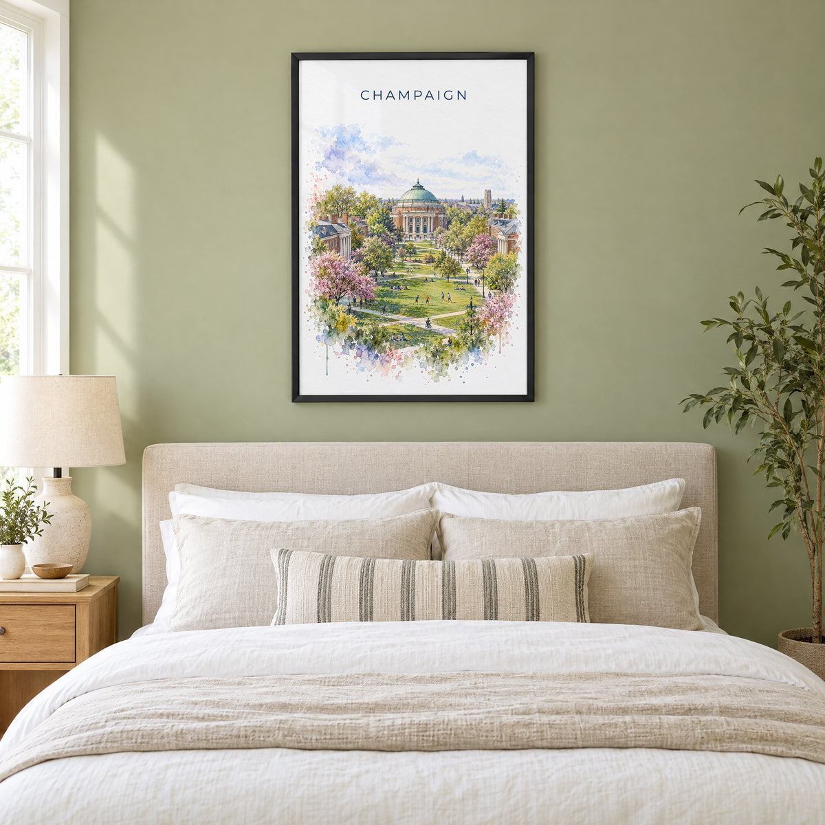 Champaign watercolor print in a black frame above an upholstered headboard in a sage green bedroom