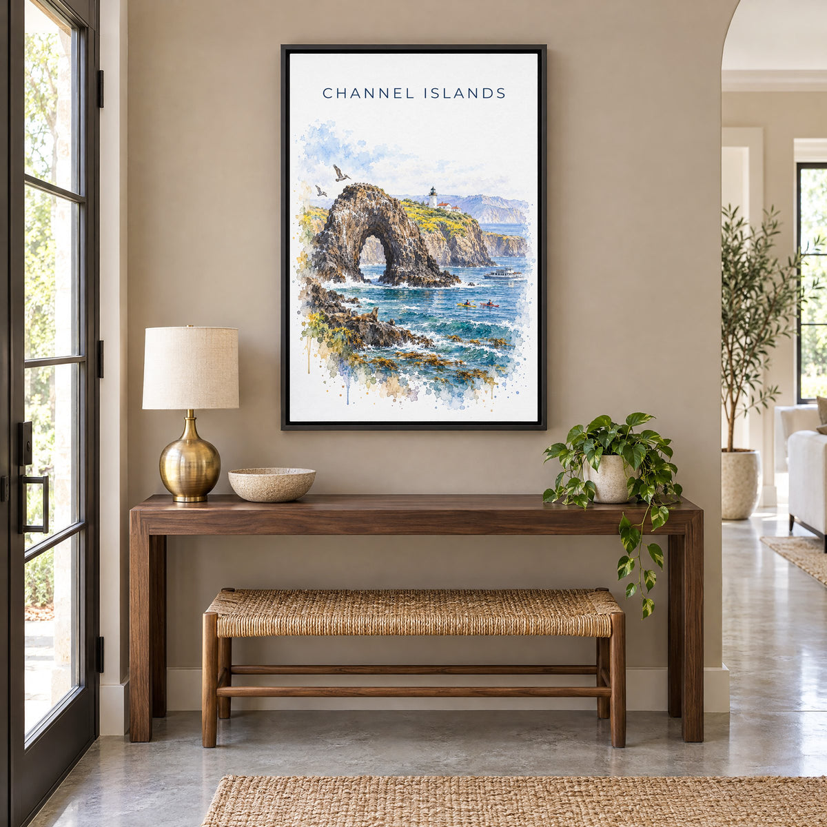 Channel Islands National Park watercolor as a black floater canvas above a walnut console and woven bench in an entryway