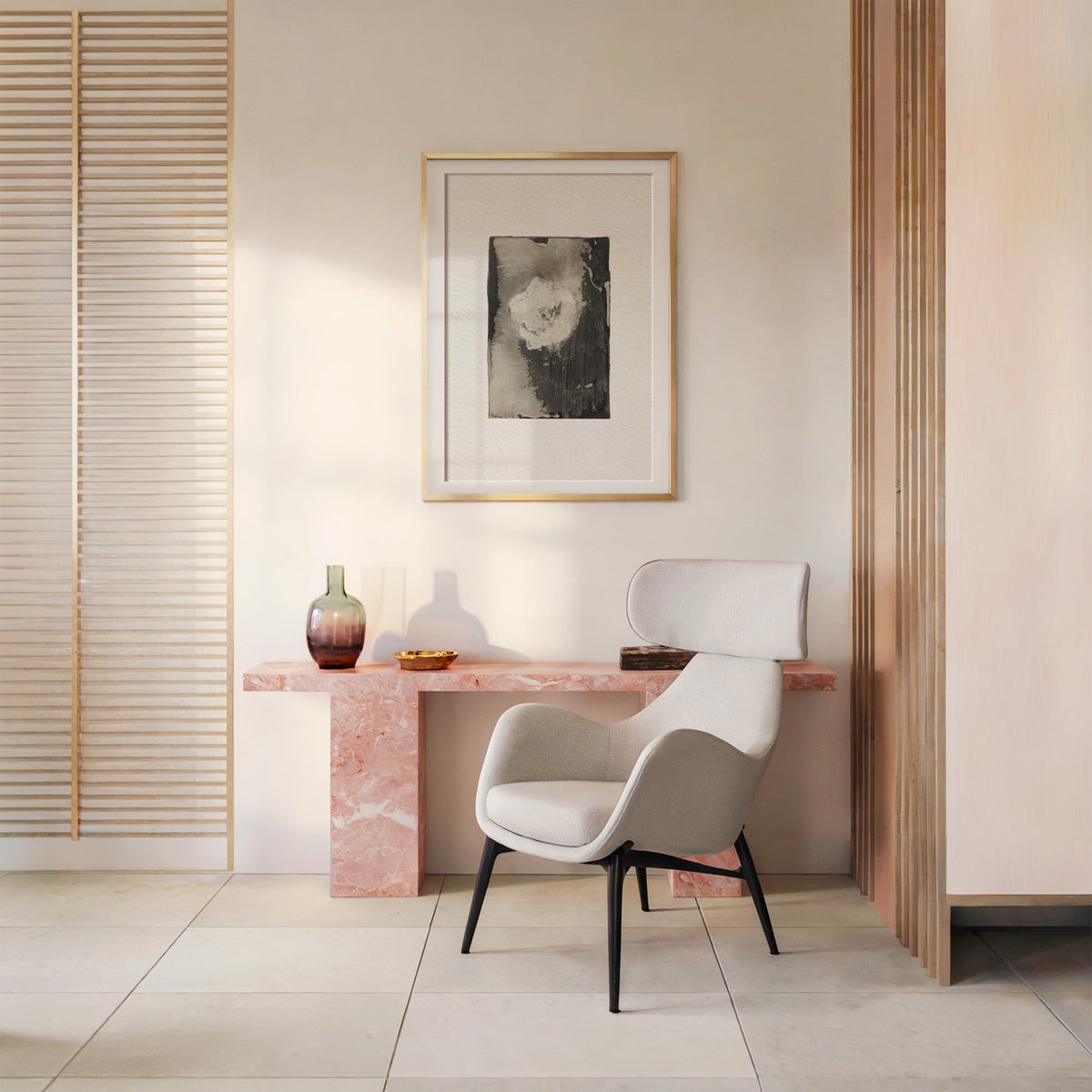 Charcoal wash with white bloom textured print shown in a gold frame with a mat above a pink marble console and armchair