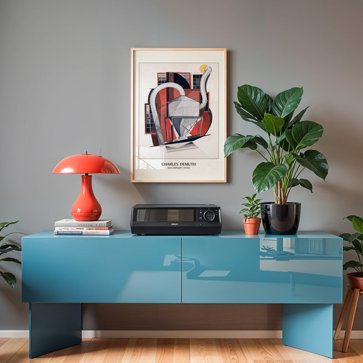 Demuth print in an oak frame above a teal sideboard with a red lamp