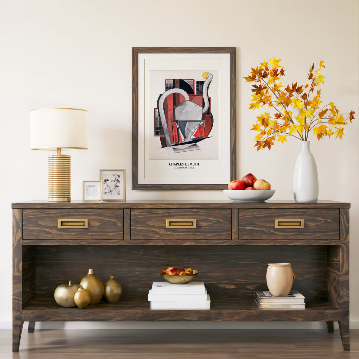 Machinery 1920 print in a walnut frame above a console with autumn branches