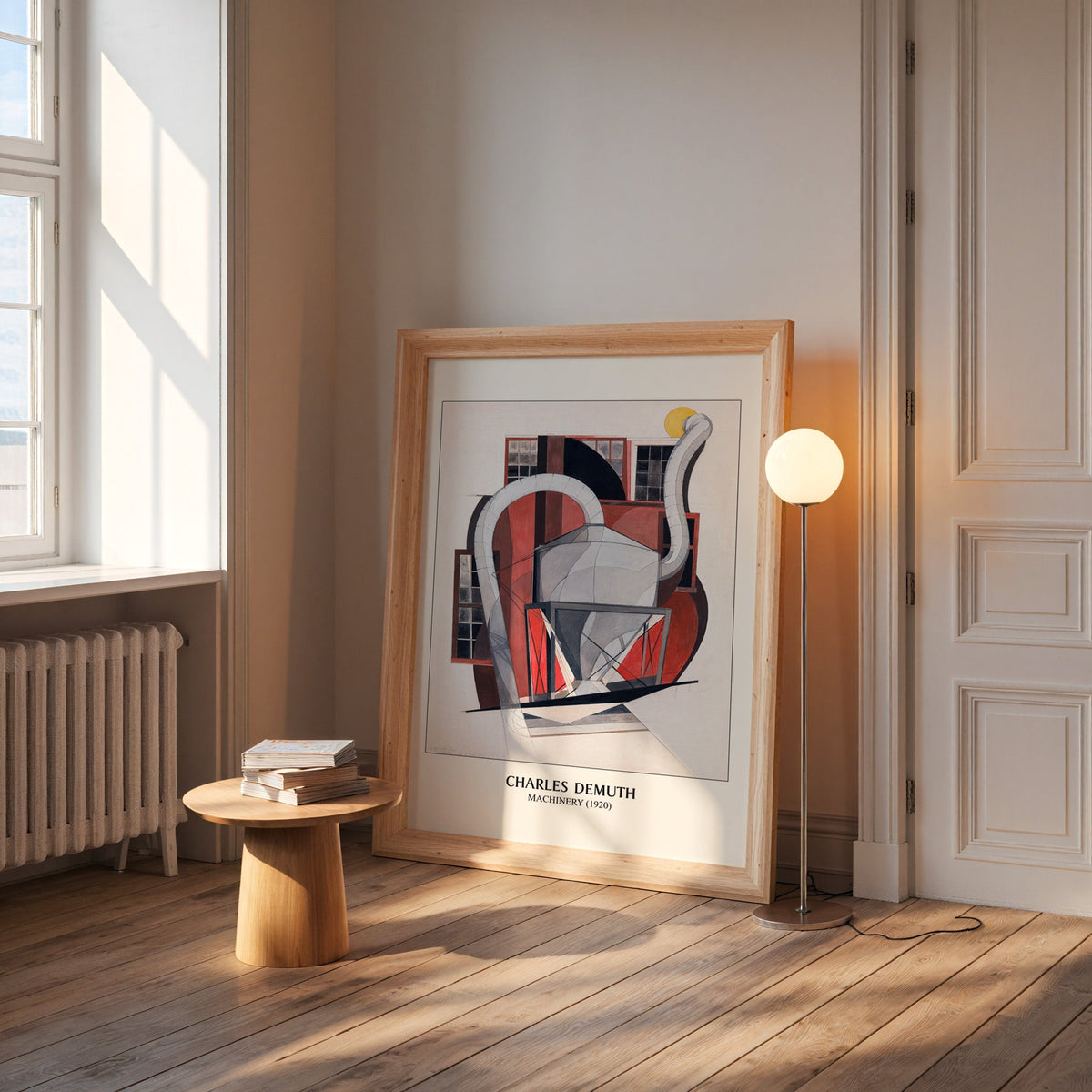 Demuth machinery print in a wide pine frame leaning by a sunlit window