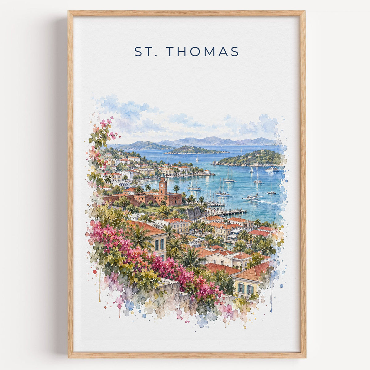 St. Thomas watercolor print in a light oak frame on a plain white wall