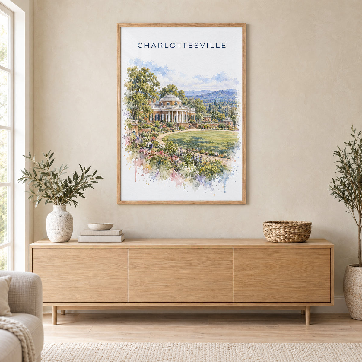 Charlottesville watercolor print in an oak frame above a light wood sideboard in a Scandinavian living room