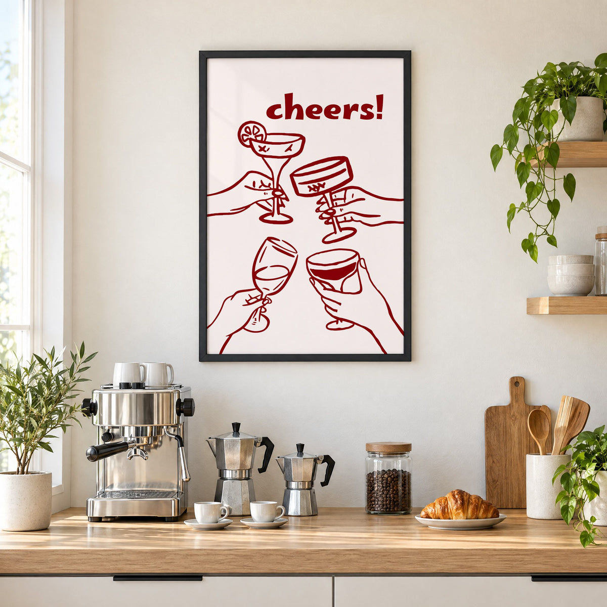 cheers! four hands toasting burgundy line print in a black frame above a home espresso bar with moka pots and espresso cups