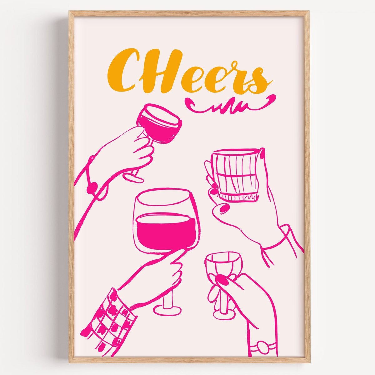CHeers hot pink toasting hands print in a light oak frame on a plain white wall