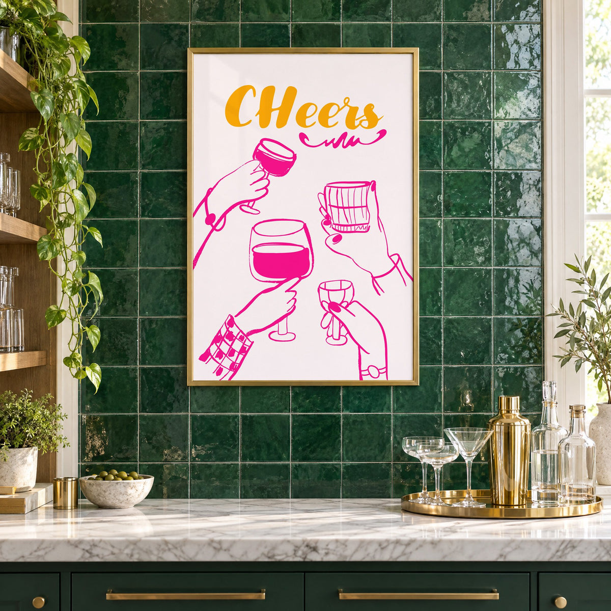 CHeers hot pink toasting hands print in a brass frame on emerald green tiles above a home bar with coupe glasses