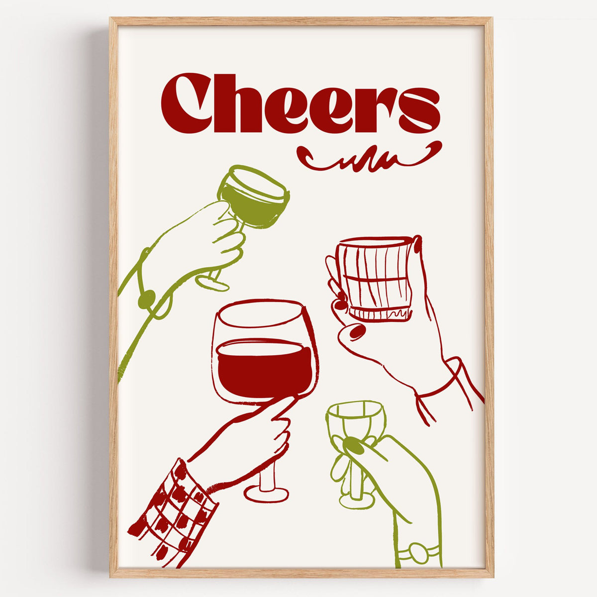 Cheers red and olive toasting hands print in a light oak frame on a plain white wall