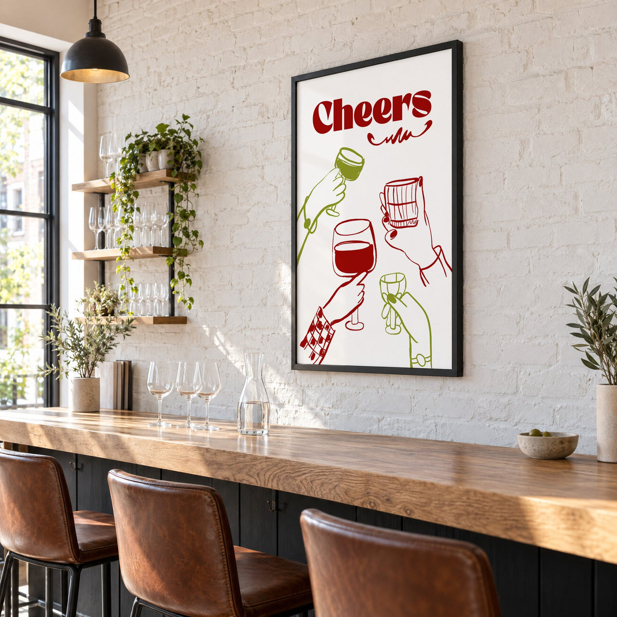 Cheers red and olive toasting hands print in a black frame on a white brick wall above a wine bar counter