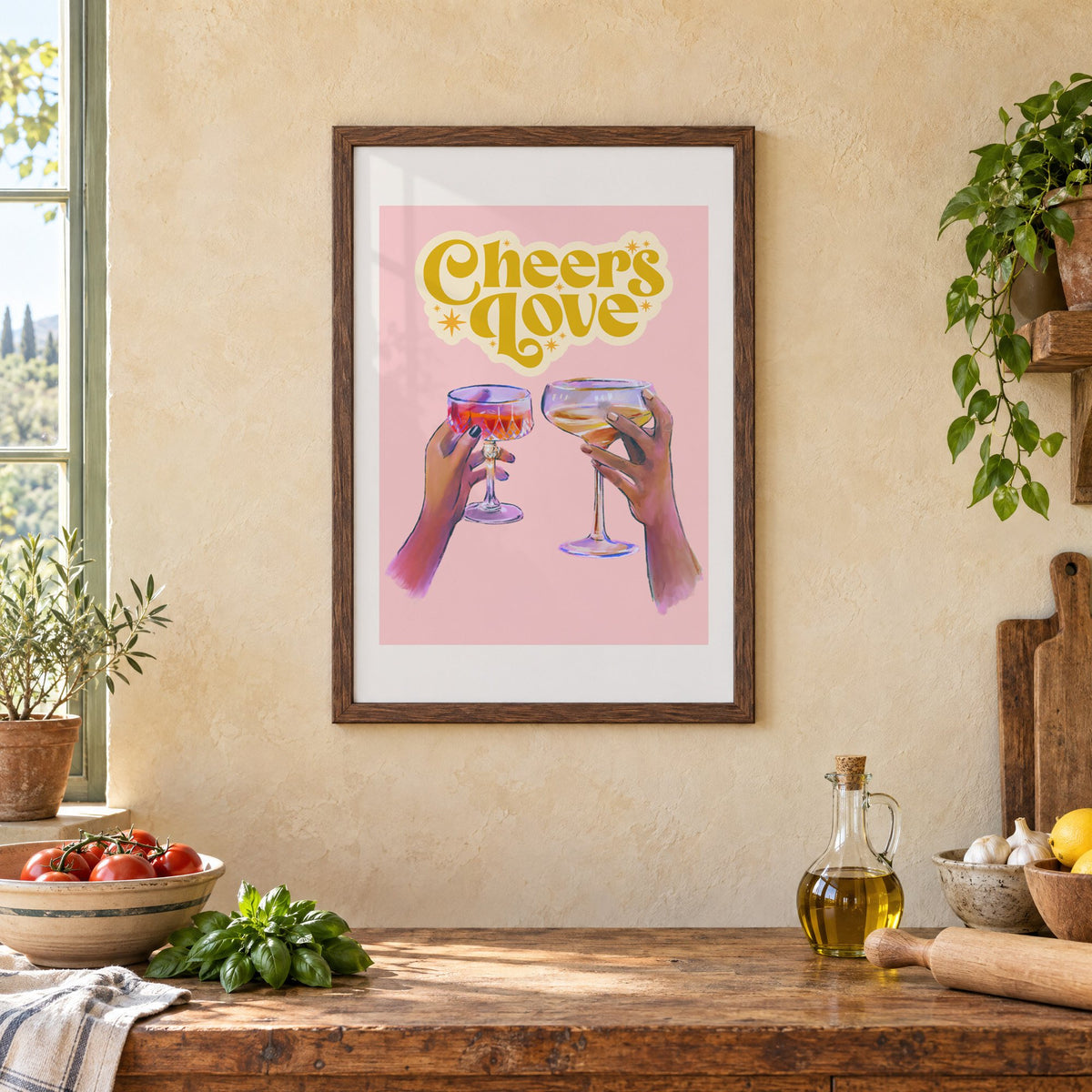 Cheers Love coupe toast print in a walnut frame above a rustic Italian kitchen table with tomatoes
