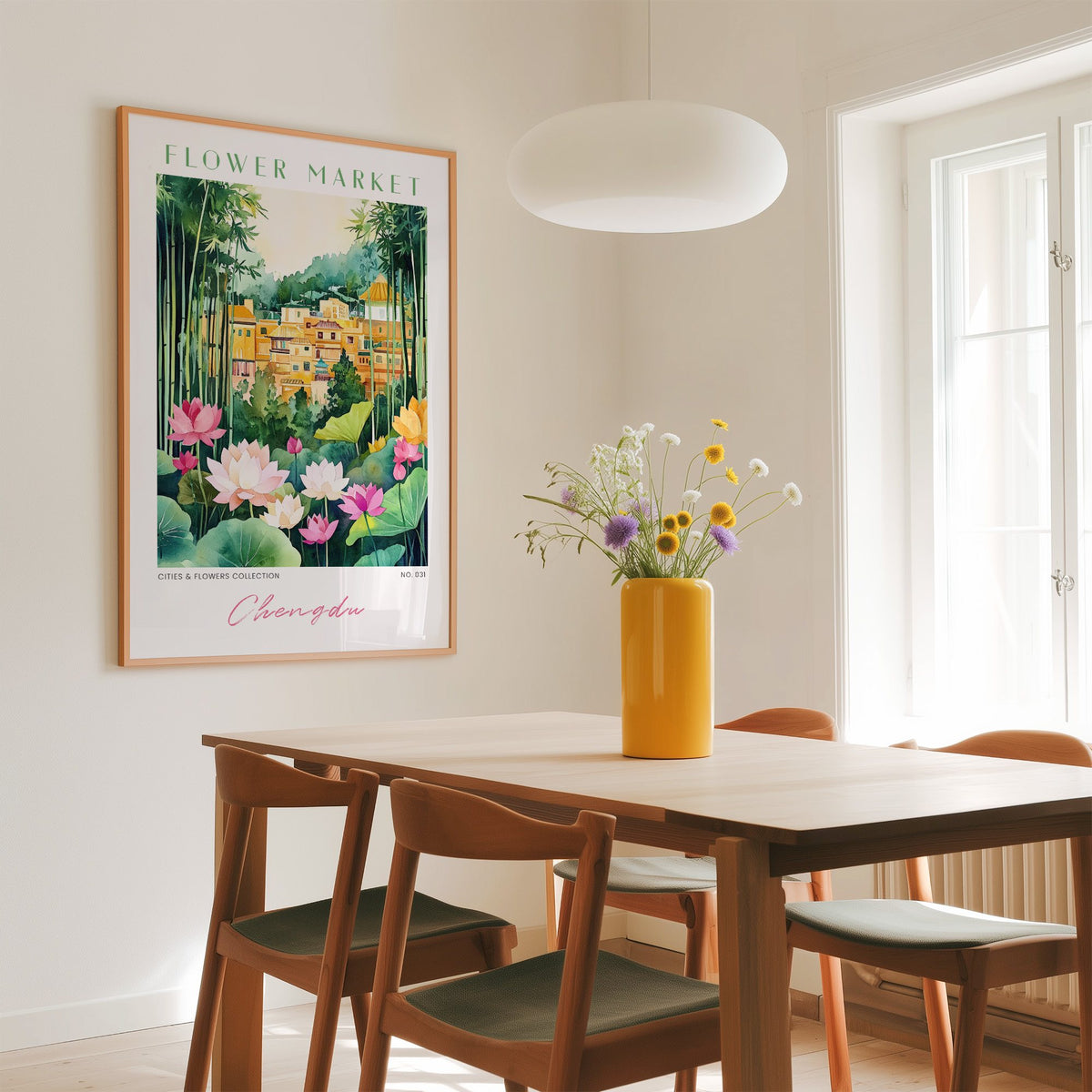 Chengdu flower market print in an oak frame above a dining table with a yellow vase and white pendant light