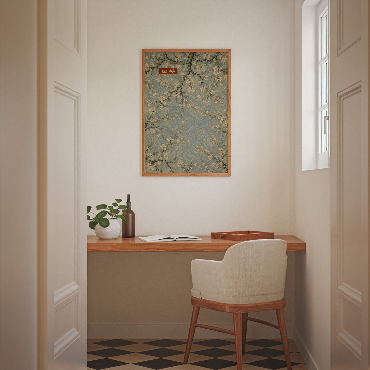 Cherry blossoms blue sky poster in an oak frame above a wall-mounted desk in a home office nook