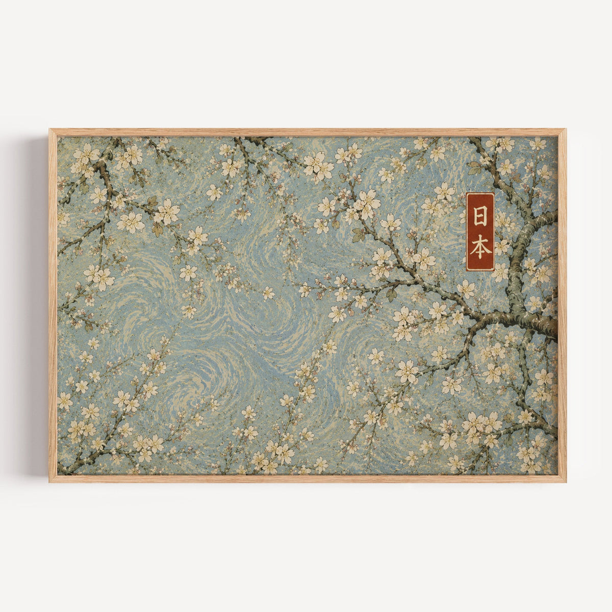 Cherry blossoms on a blue swirl sky print in a light oak frame on a plain white wall