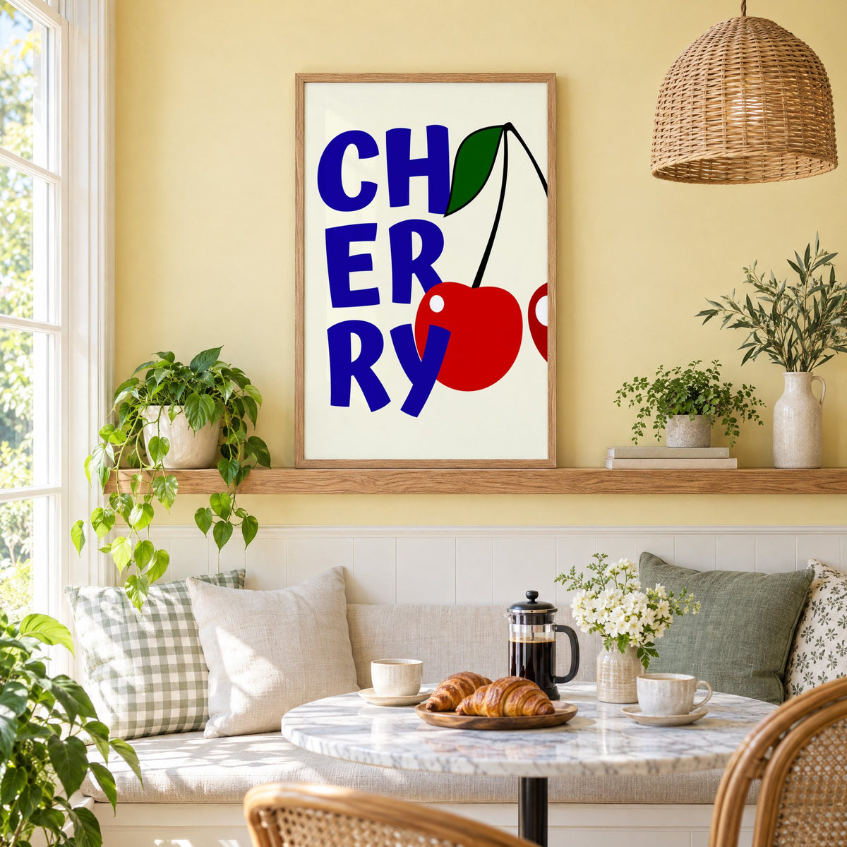 Cherry bold navy letters print in an oak frame on a picture ledge above a sunny breakfast nook